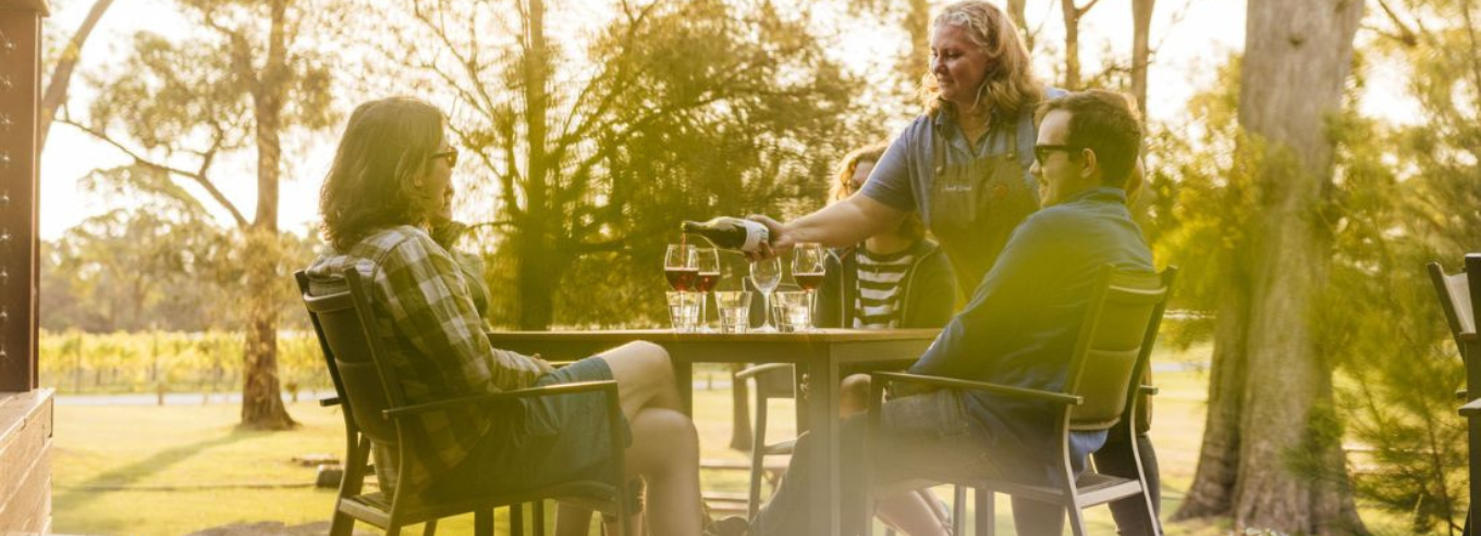 A couple enjoying Small Wonder wine at the patio